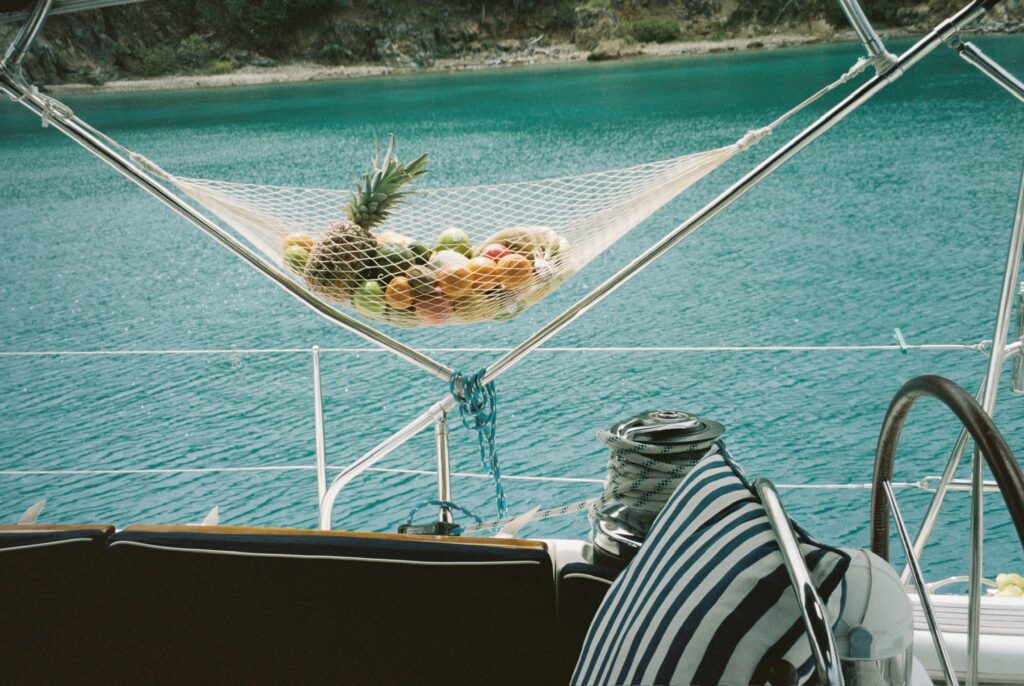 Crewed sailing yacht anchored in a calm bay in the British Virgin Islands.